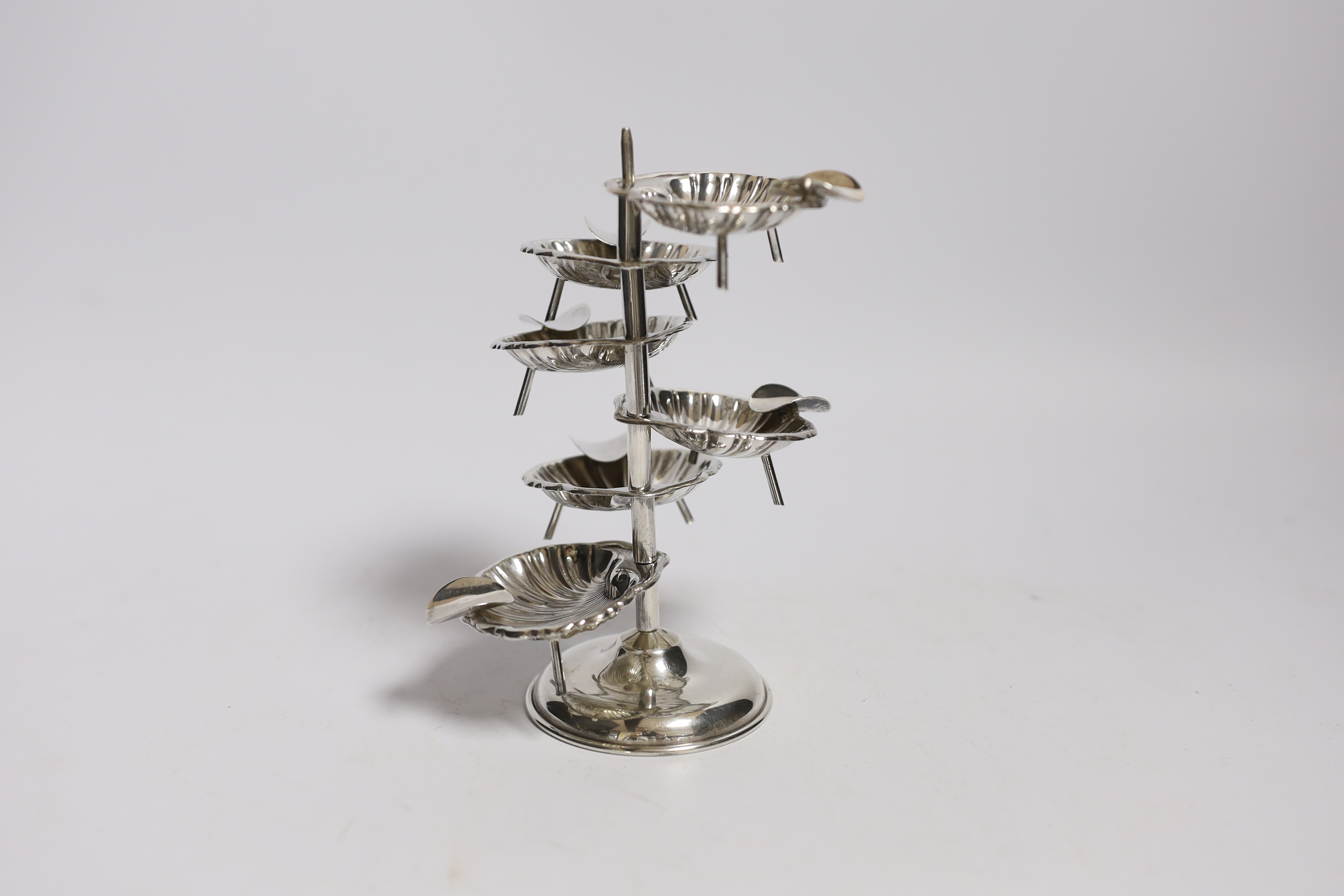 A Mexican 925 sterling ashtray stand, with six detachable shell shaped 925 sterling ashtrays, overall height 14.2cm, 3.8 oz.